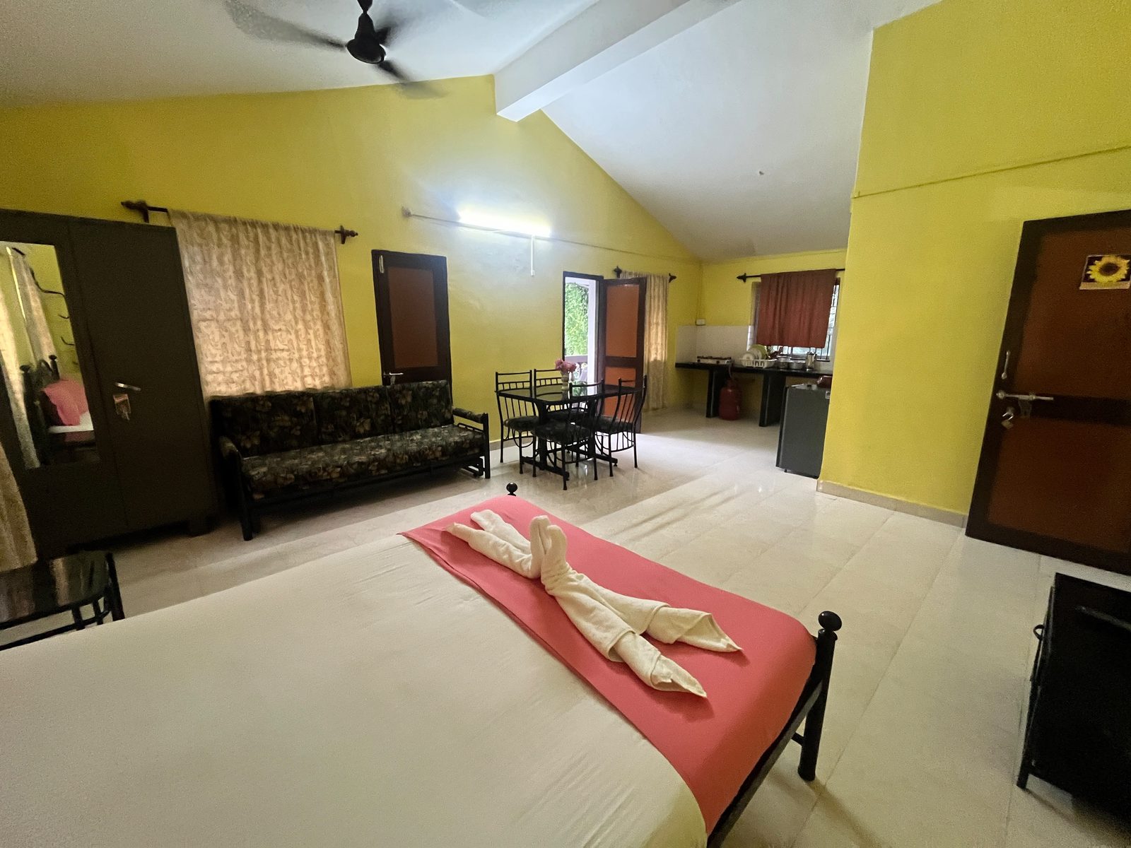 Family Room with bed, living area and kitchen